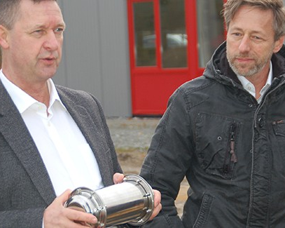 Paul Kaiser and Thomas Passlack with a time capsule